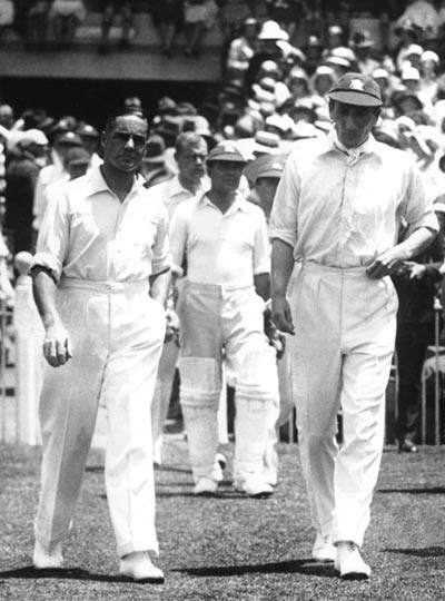 Douglas Jardine leads the England cricket team onto the field for the second test match at Melbourne in 1933. Photograph : Allsport
